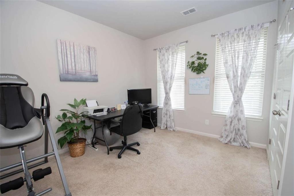 531 Carleton Place Locust Grove, GA 30248 - Photo 33 of 41 a view of a workspace with furniture and a window