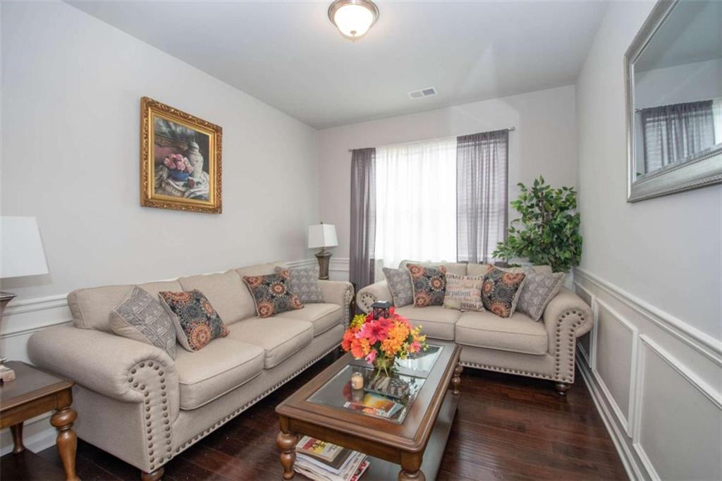 531 Carleton Place Locust Grove, GA 30248 - Photo 10 of 41 a living room with furniture and a potted plant