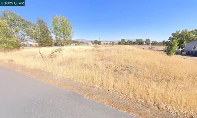 a view of a backyard of a house