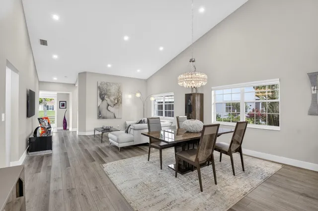 a kitchen with a table and chairs in it