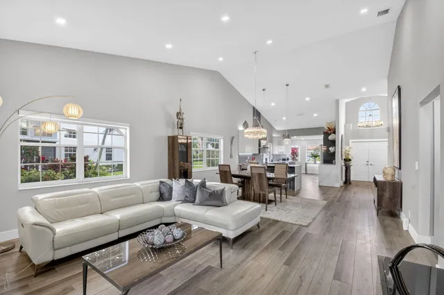a view of a dining room with furniture wooden floor and chandelier
