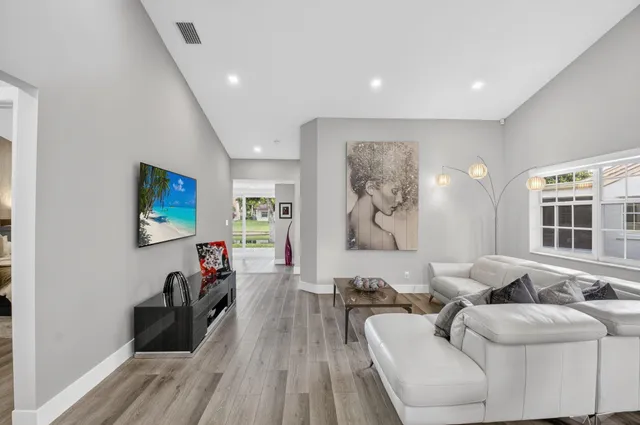 a living room with furniture and a large window