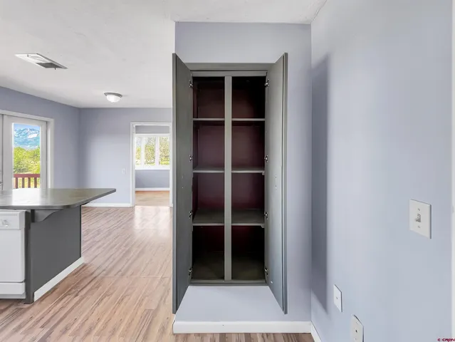 a view of entryway with wooden floor and a window