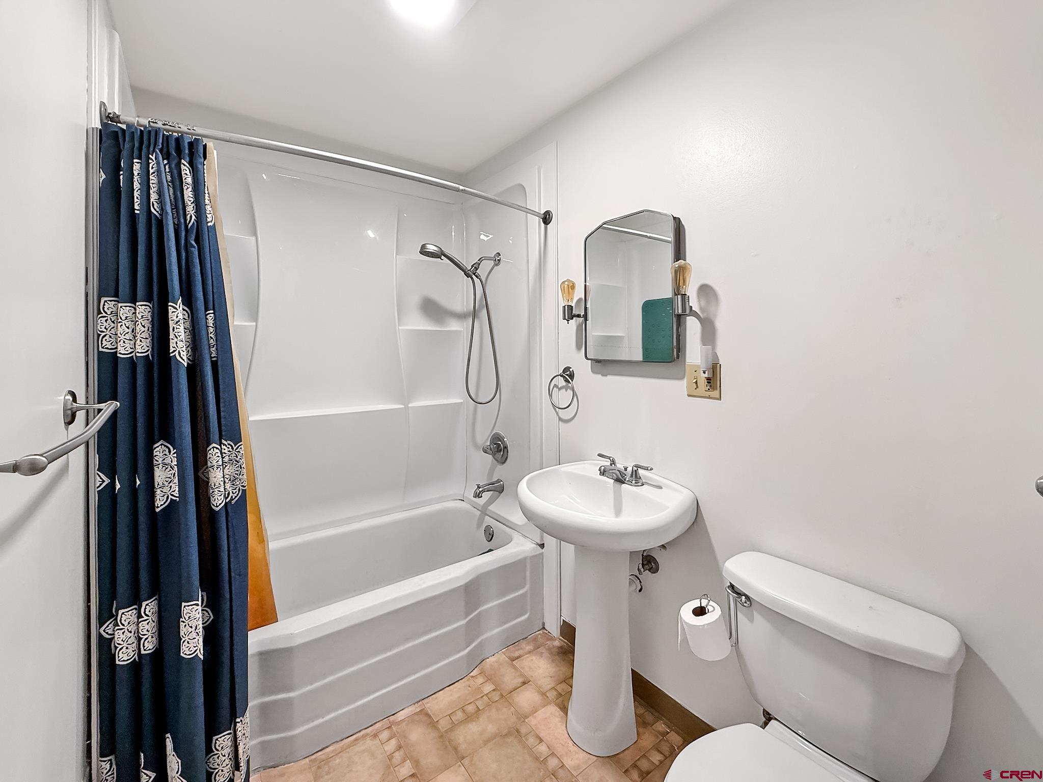2001 Black Canyon Road Crawford, CO 81415 - Photo 30 of 45 a bathroom with a sink toilet and shower