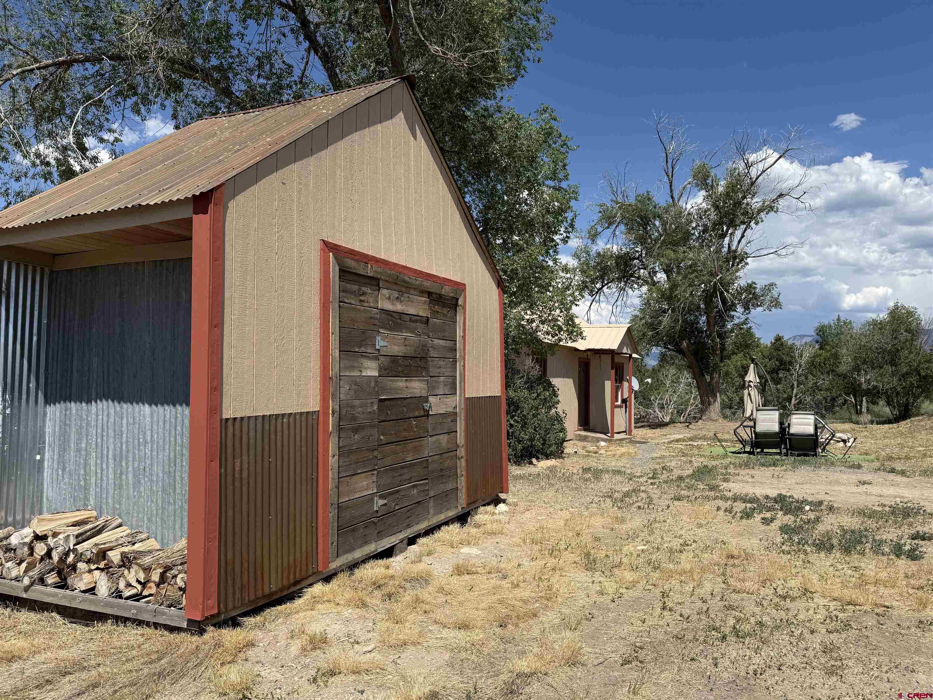 2001 Black Canyon Road Crawford, CO 81415 - Photo 3 of 45 a view of a house with a snow in the yard