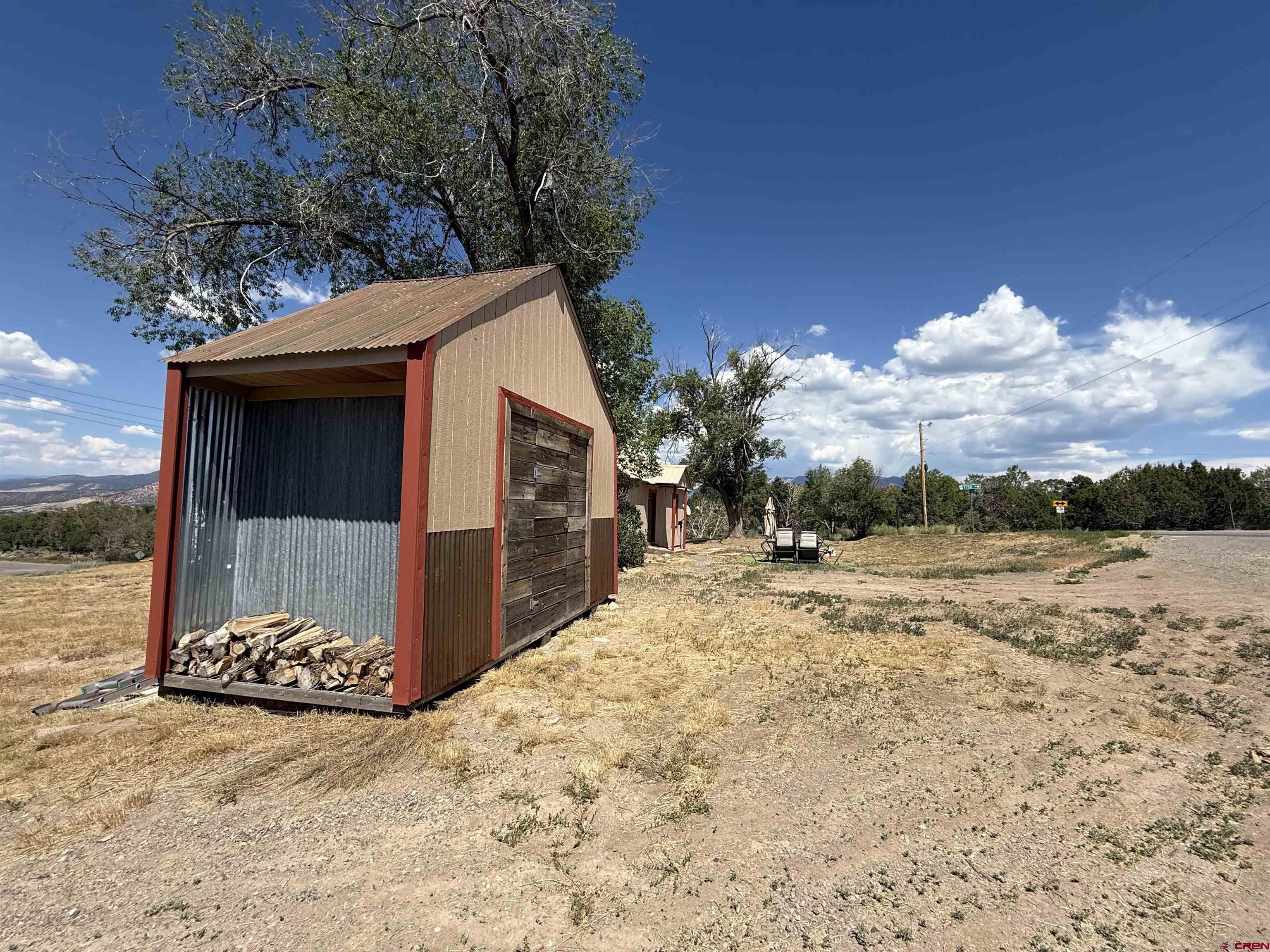 2001 Black Canyon Road Crawford, CO 81415 - Photo 39 of 45 a view of a house with a yard