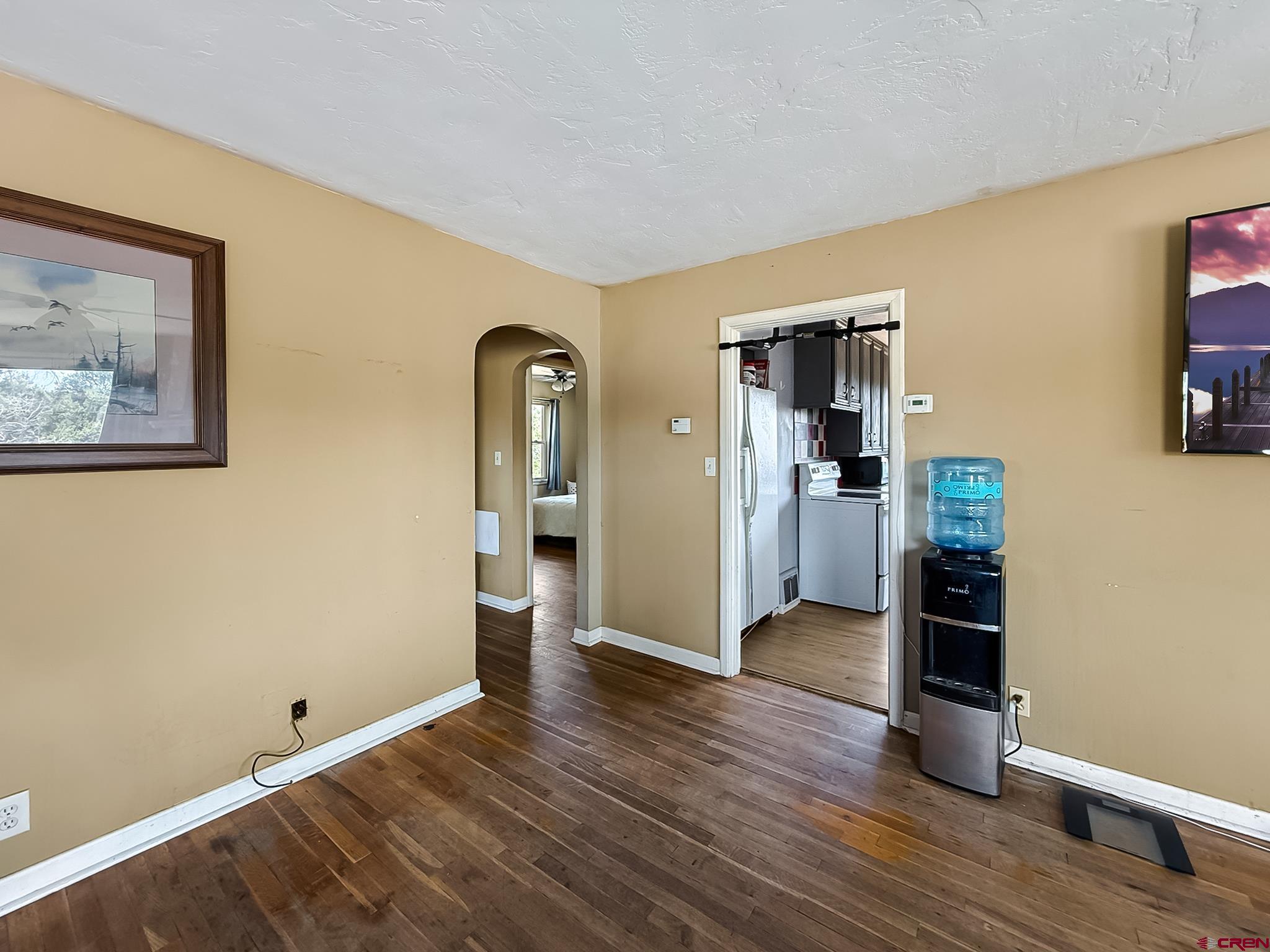 2001 Black Canyon Road Crawford, CO 81415 - Photo 9 of 45 a view of empty room with wooden floor and fan