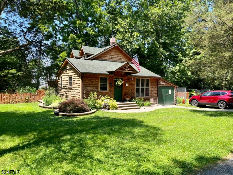 35 Stillwater Road Blairstown, NJ 07825 - Photo 1 of 13 a front view of a house with swimming pool having outdoor seating