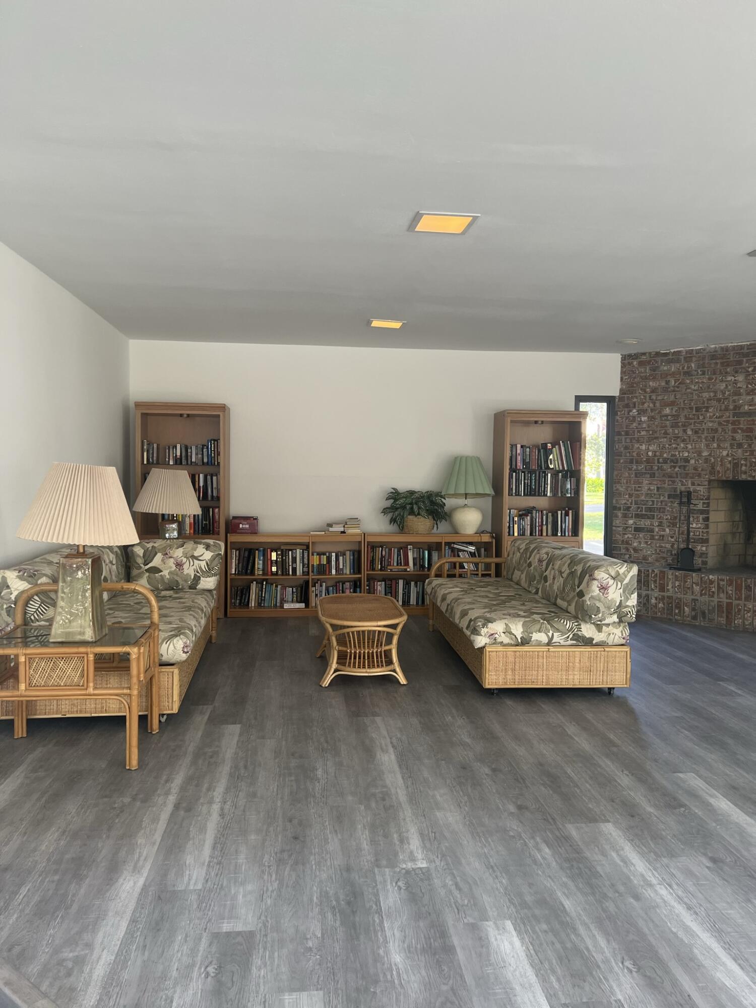 1605 Highway 1, Unit 201M2 Jupiter, FL 33477 - Photo 31 of 47 a living room with furniture and a wooden floor