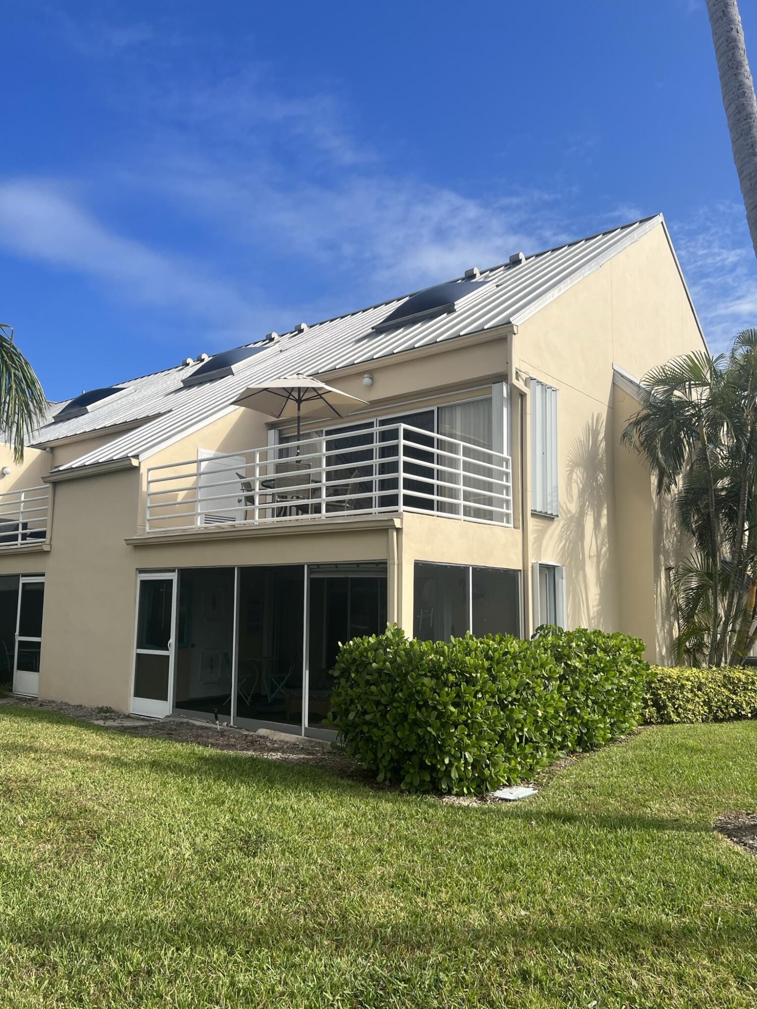 1605 Highway 1, Unit 201M2 Jupiter, FL 33477 - Photo 37 of 47 a view of a house with backyard and garden