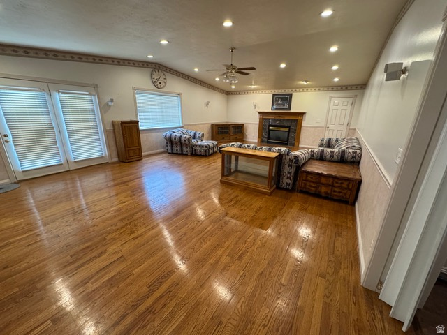 588 North 4500 West West Point, UT 84015 - Photo 4 of 61 Great room featuring hardwood flooring, a glass covered fireplace, ceiling fan, recessed lighting, and vaulted ceiling