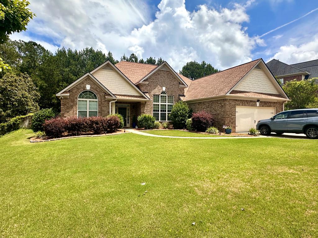 6712 Bridge Way Columbus, GA 31904 - Photo 1 of 36 a front view of a house with garden