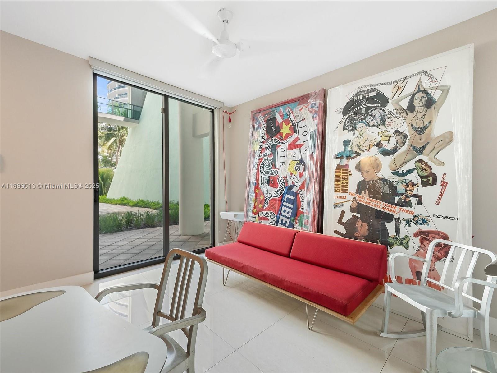 6000 Collins Avenue, Unit 132 Miami Beach, FL 33140 - Photo 14 of 24 a bedroom with furniture and a window