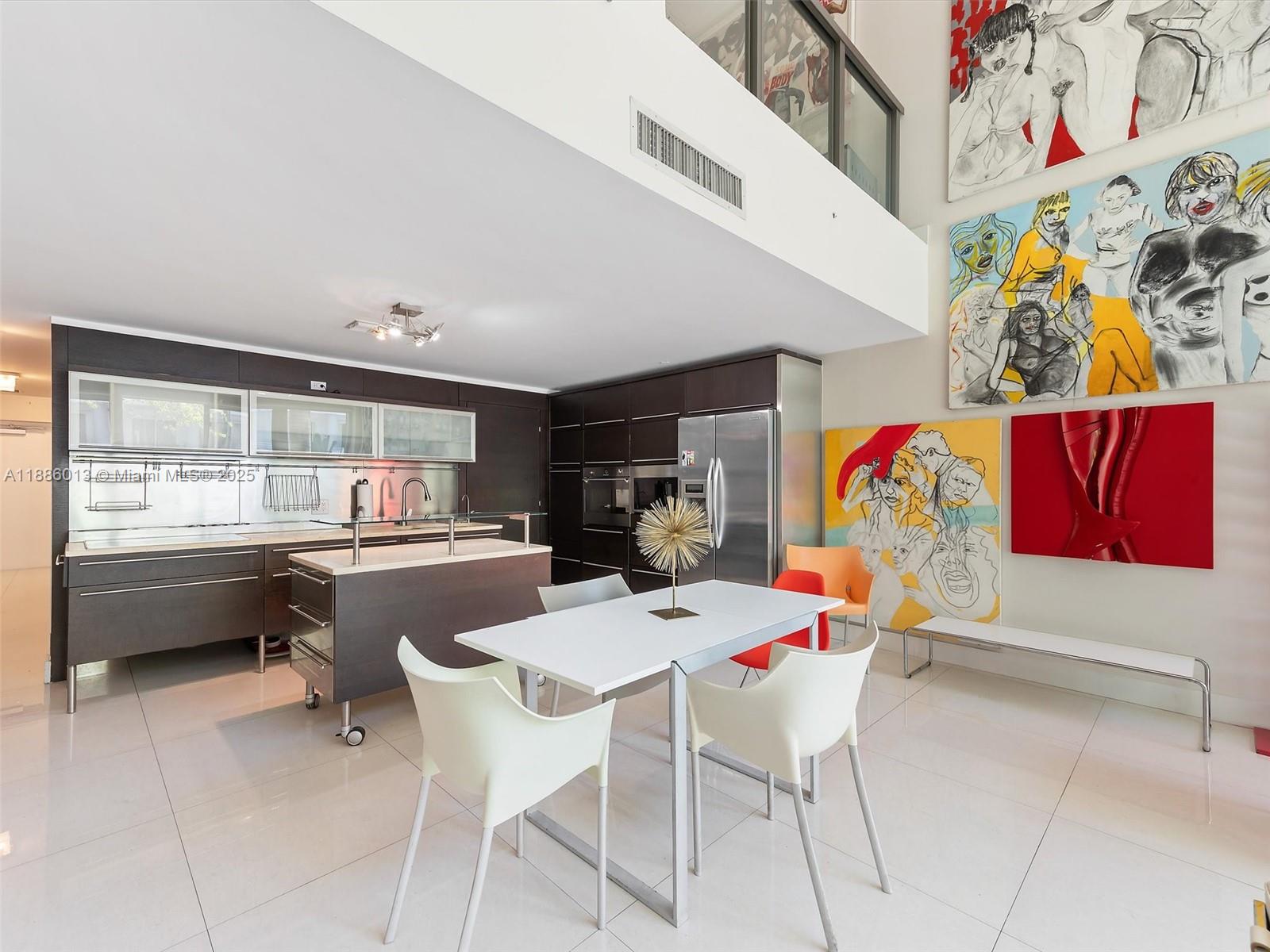 6000 Collins Avenue, Unit 132 Miami Beach, FL 33140 - Photo 7 of 24 a dining hall with furniture and a floor to ceiling window