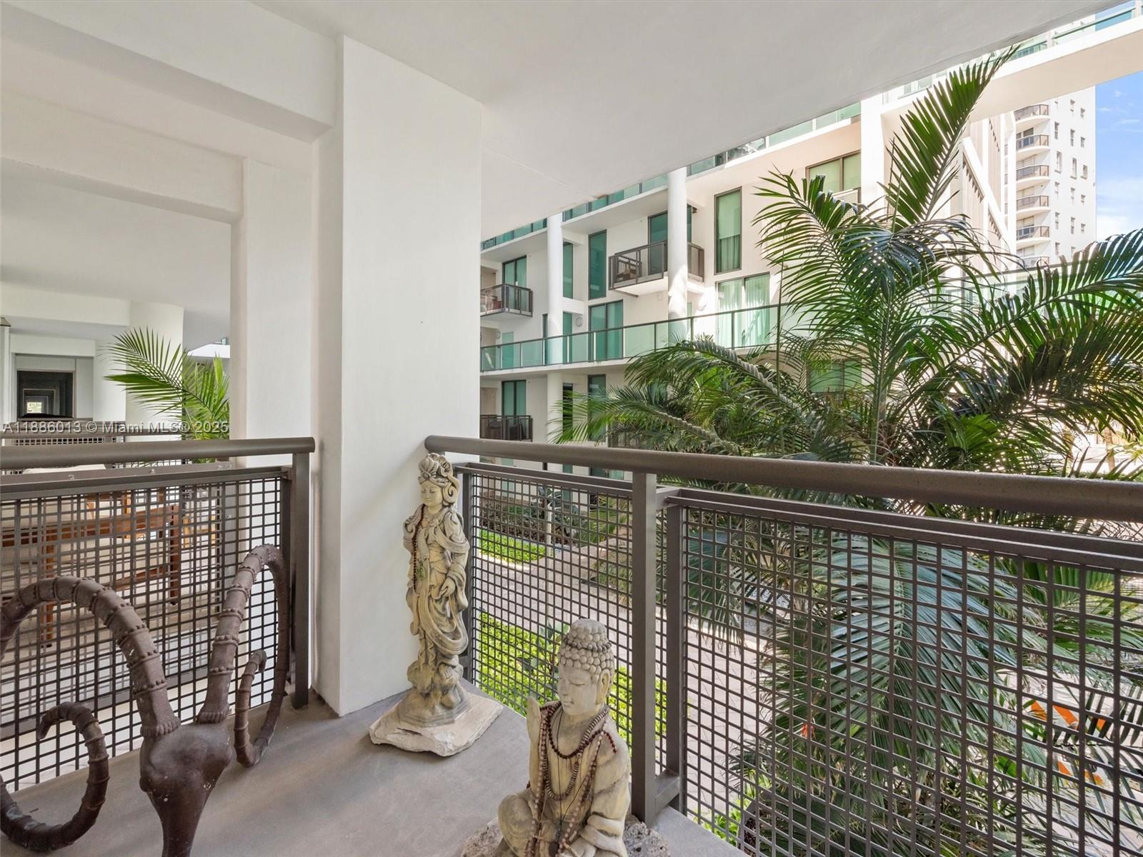 6000 Collins Avenue, Unit 132 Miami Beach, FL 33140 - Photo 9 of 24 a view of balcony with furniture