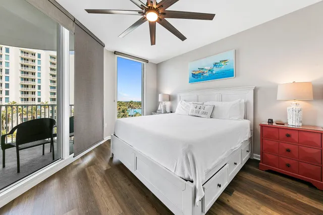 a spacious bedroom with a bed and a window