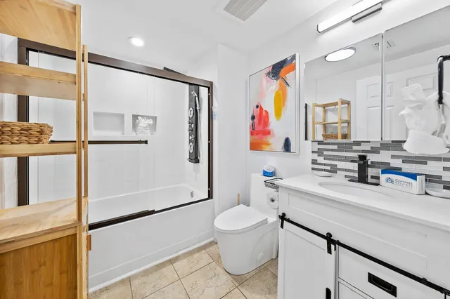 a bathroom with a shower and toilet
