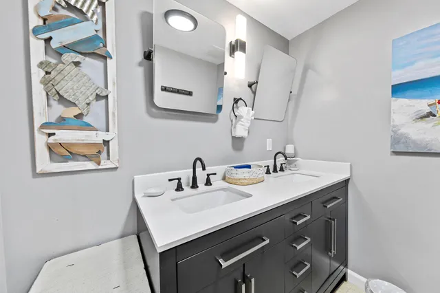 a view of a balcony with chair and iron stairs