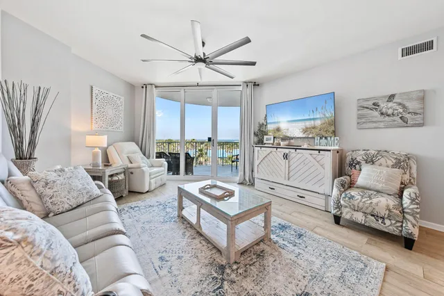 a living room with furniture and a rug