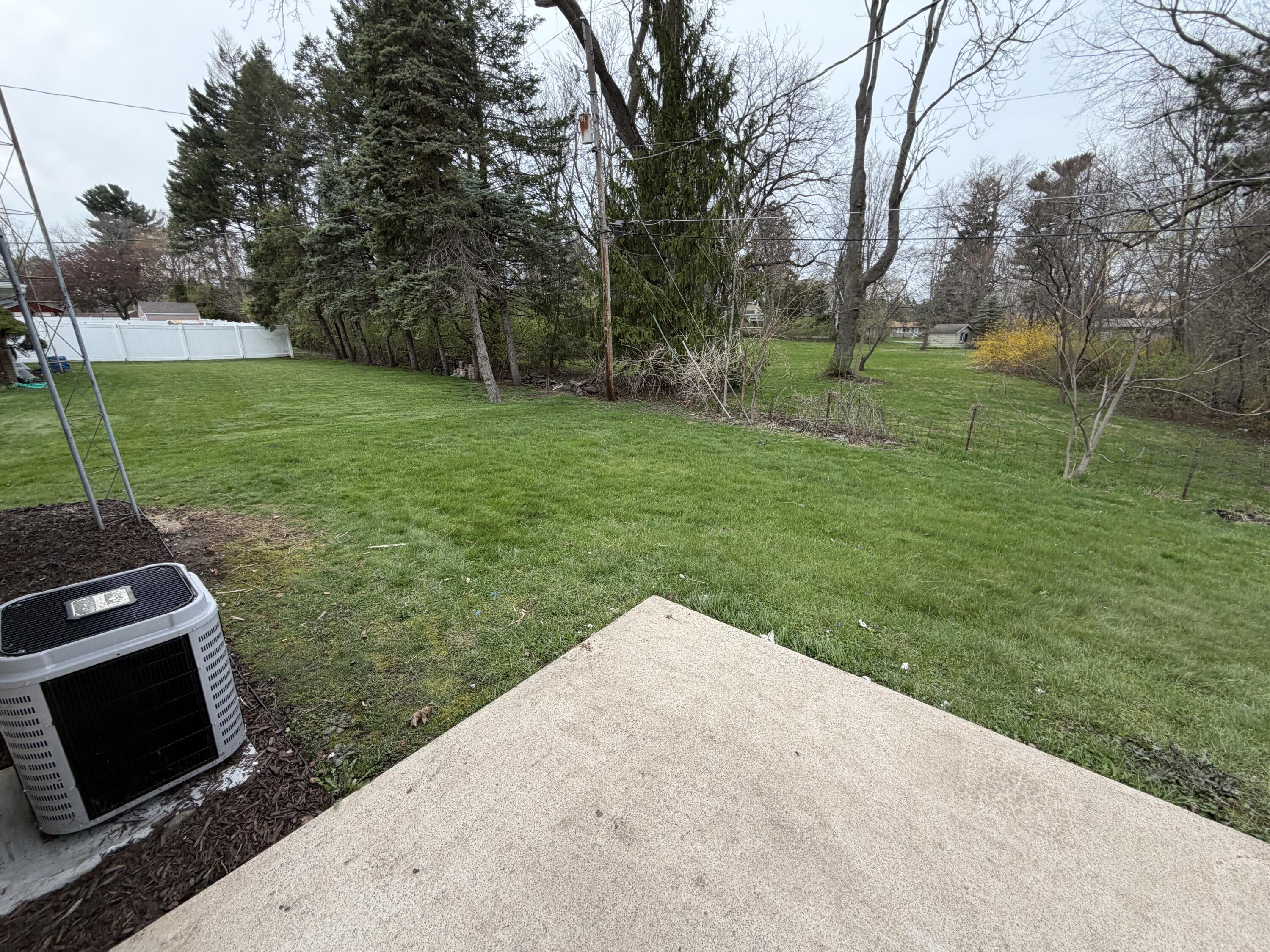 603 West 13th Street La Porte, IN 46350 - Photo 18 of 18 a backyard of a house with table and chairs