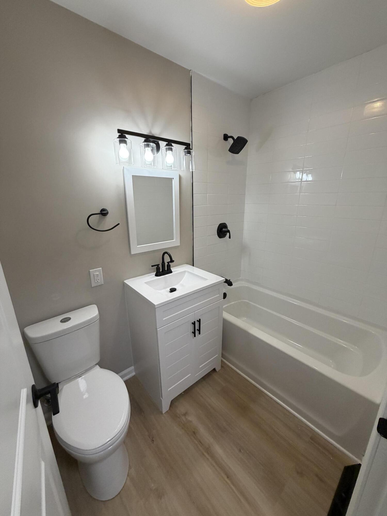 603 West 13th Street La Porte, IN 46350 - Photo 10 of 18 a bathroom with a toilet a sink and bathtub