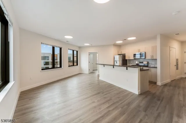 a view of kitchen with wooden floor