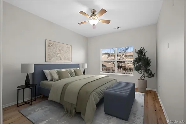 a spacious bedroom with a large bed and a window