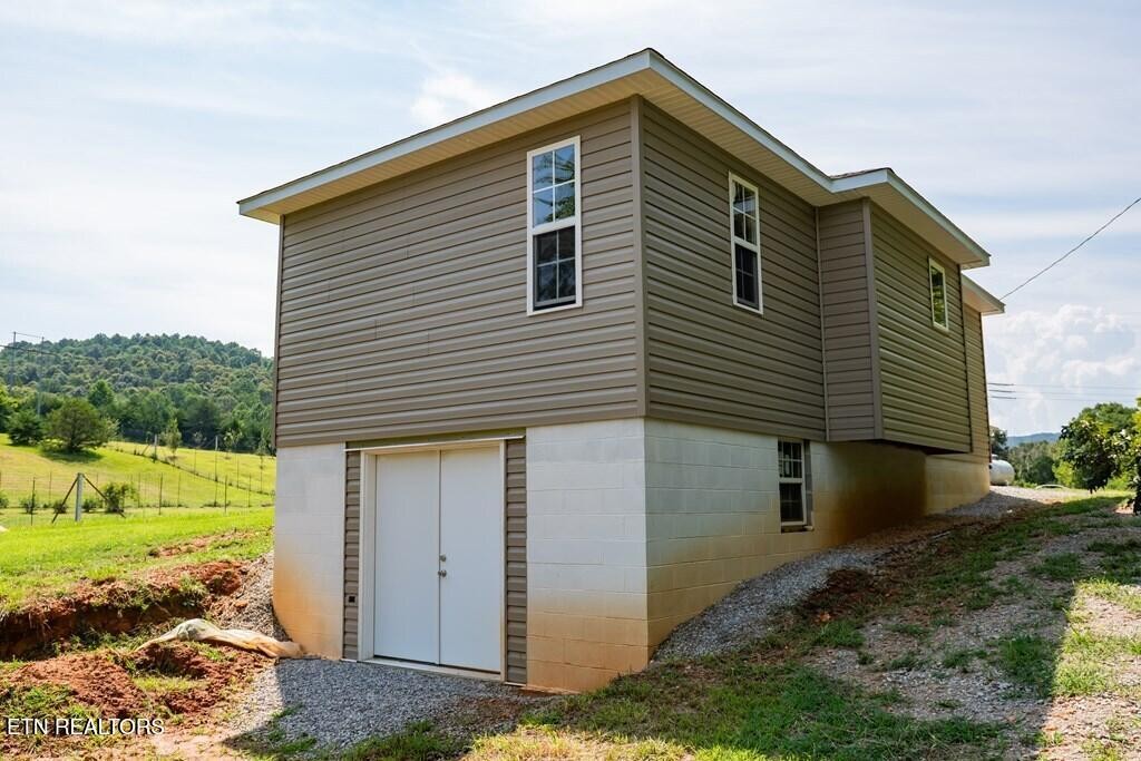 1518 Cummingsville And Sparkman Road Doyle, TN 38559 - Photo 46 of 58 a front view of a house with a yard