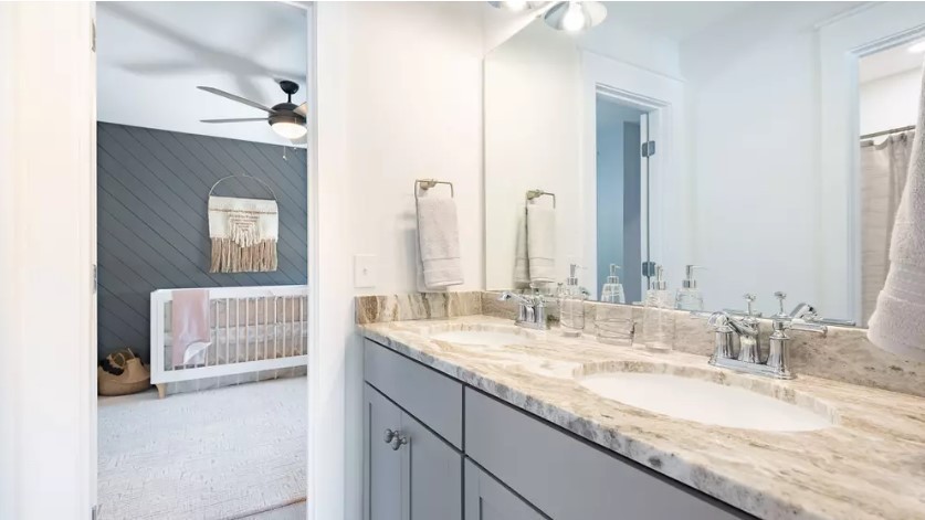 686 Conifer Dr Spring Hill Thompson's Station, TN 37179 - Photo 19 of 22 a bathroom with a granite countertop sink and a mirror