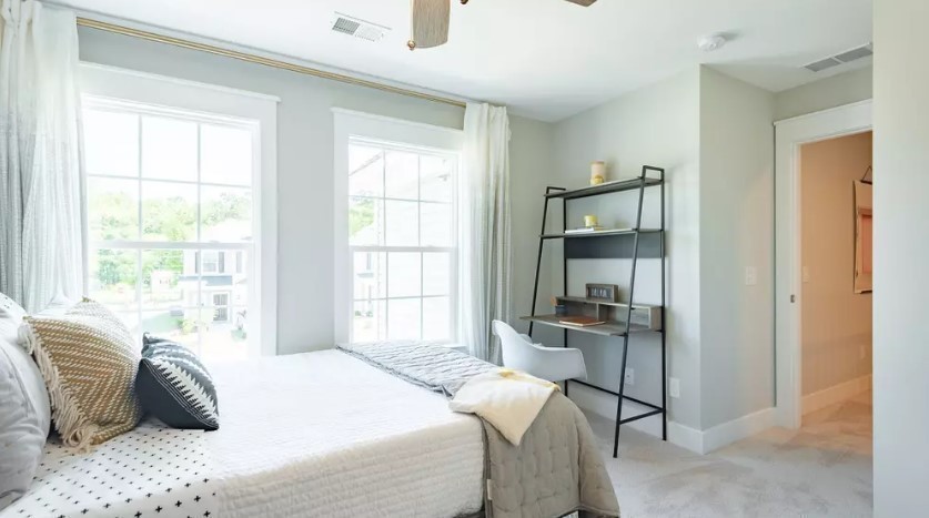 686 Conifer Dr Spring Hill Thompson's Station, TN 37179 - Photo 22 of 22 a bedroom with a bed and a window