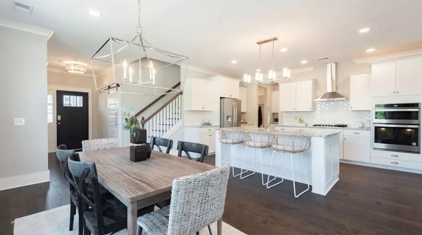 686 Conifer Dr Spring Hill Thompson's Station, TN 37179 - Photo 5 of 22 a open dining room with kitchen island furniture a chandelier and kitchen view