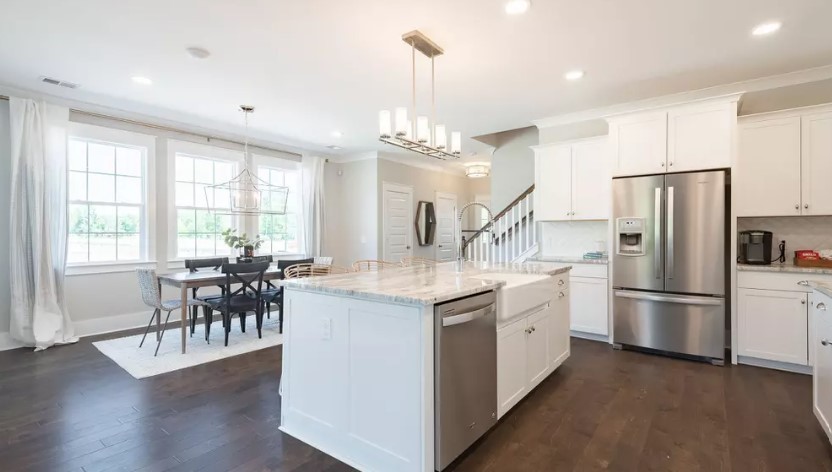 686 Conifer Dr Spring Hill Thompson's Station, TN 37179 - Photo 6 of 22 a kitchen with appliances cabinets and wooden floor