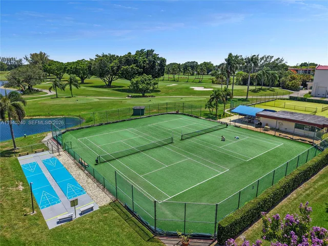 a view of an outdoor space and tennis court