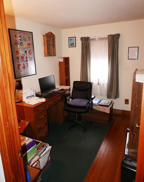 19 Glenmere Street Lowell, MA 01852 - Photo 6 of 12 a work room with furniture wooden floor and a window