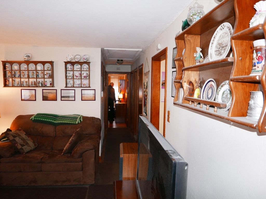 19 Glenmere Street Lowell, MA 01852 - Photo 7 of 12 a view of a livingroom with furniture and window