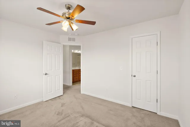 a view of a bathroom from a hallway