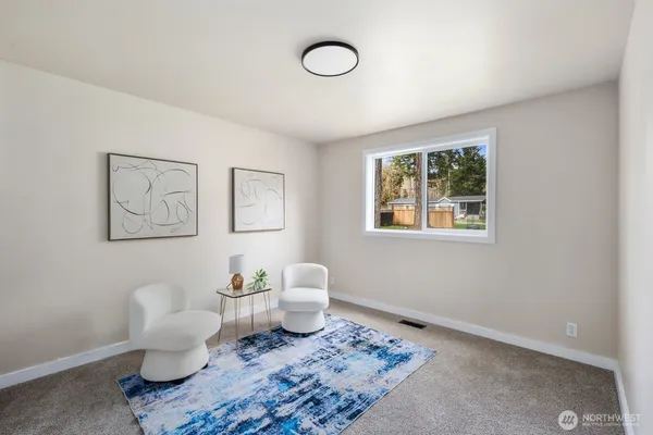 a work room with furniture and a window
