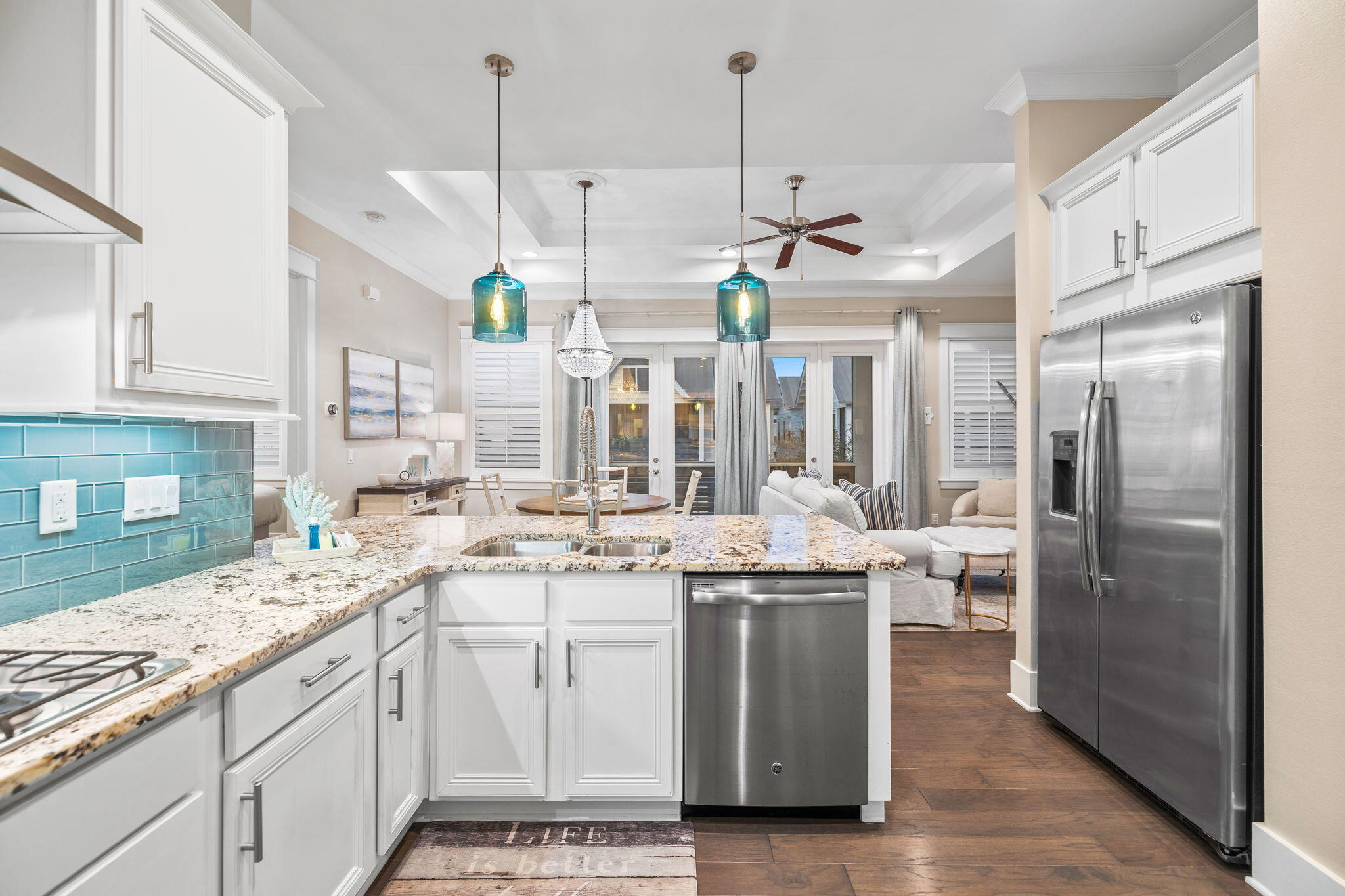67 Milestone Dr Inlet Beach, Unit C Inlet Beach, FL 32461 - Photo 14 of 39 a kitchen with a sink stainless steel appliances and chandelier