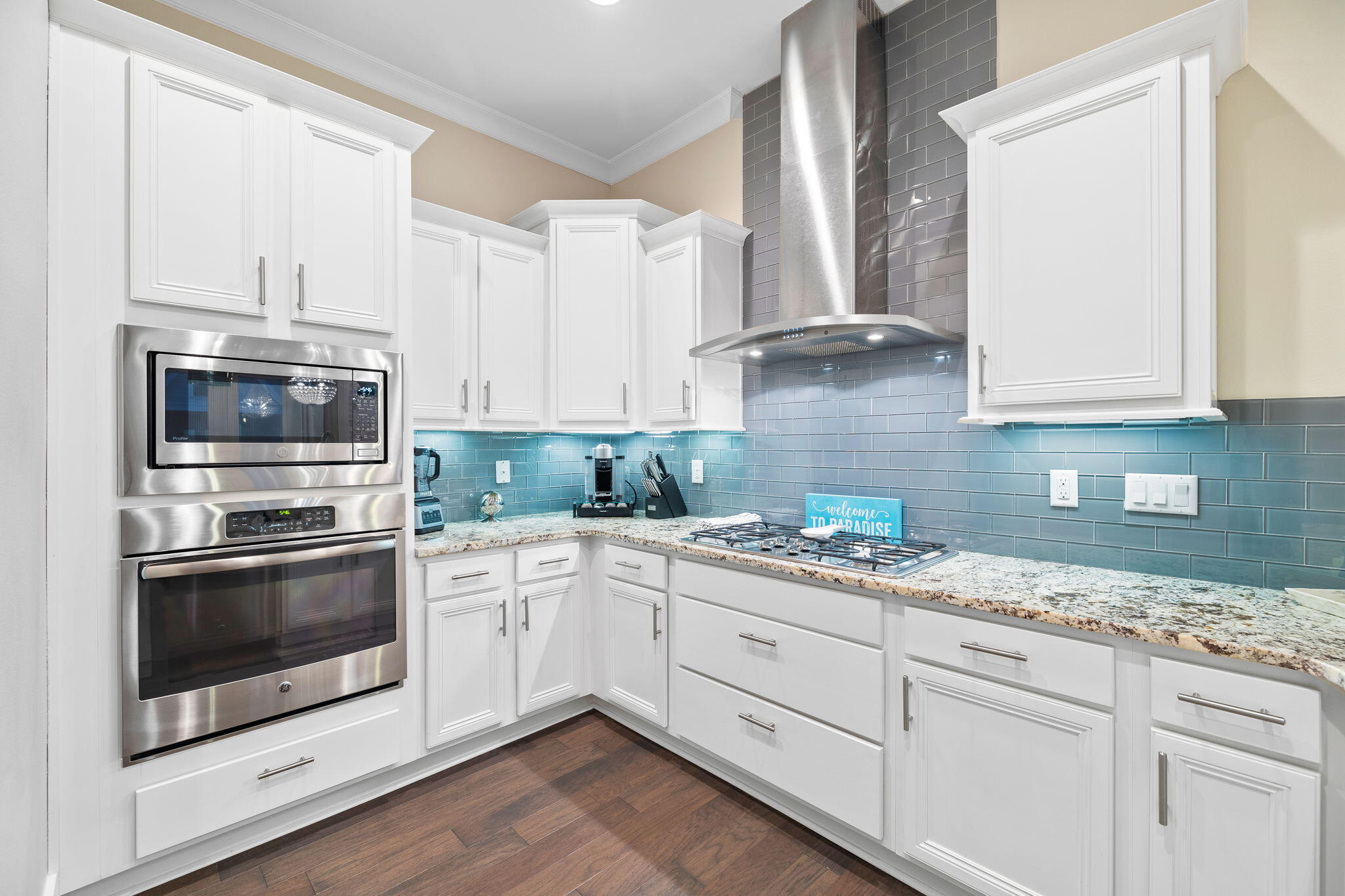 67 Milestone Dr Inlet Beach, Unit C Inlet Beach, FL 32461 - Photo 15 of 39 a kitchen with granite countertop white cabinets stainless steel appliances and a sink