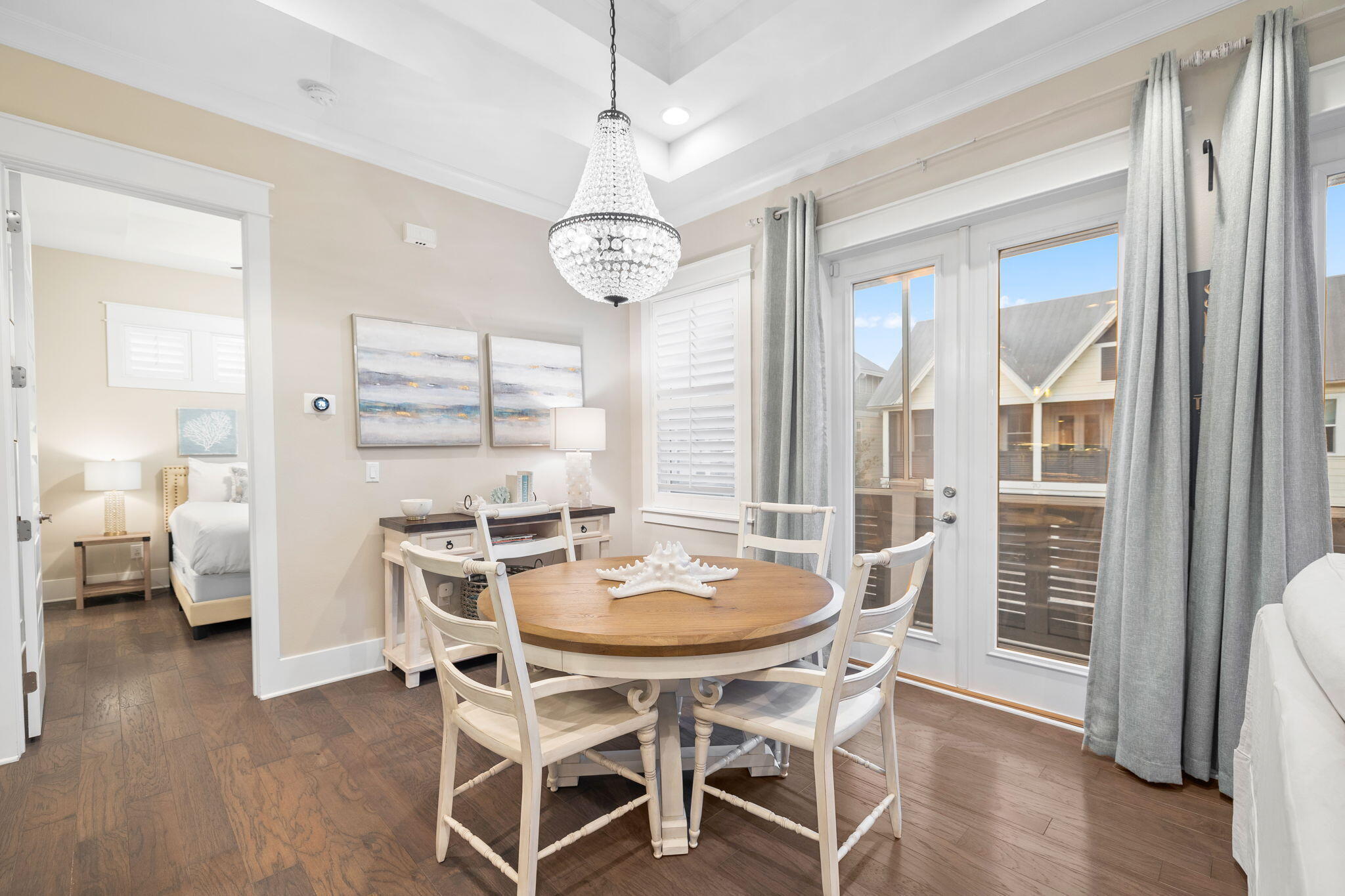 67 Milestone Dr Inlet Beach, Unit C Inlet Beach, FL 32461 - Photo 18 of 39 a view of a dining room with furniture wooden floor and chandelier