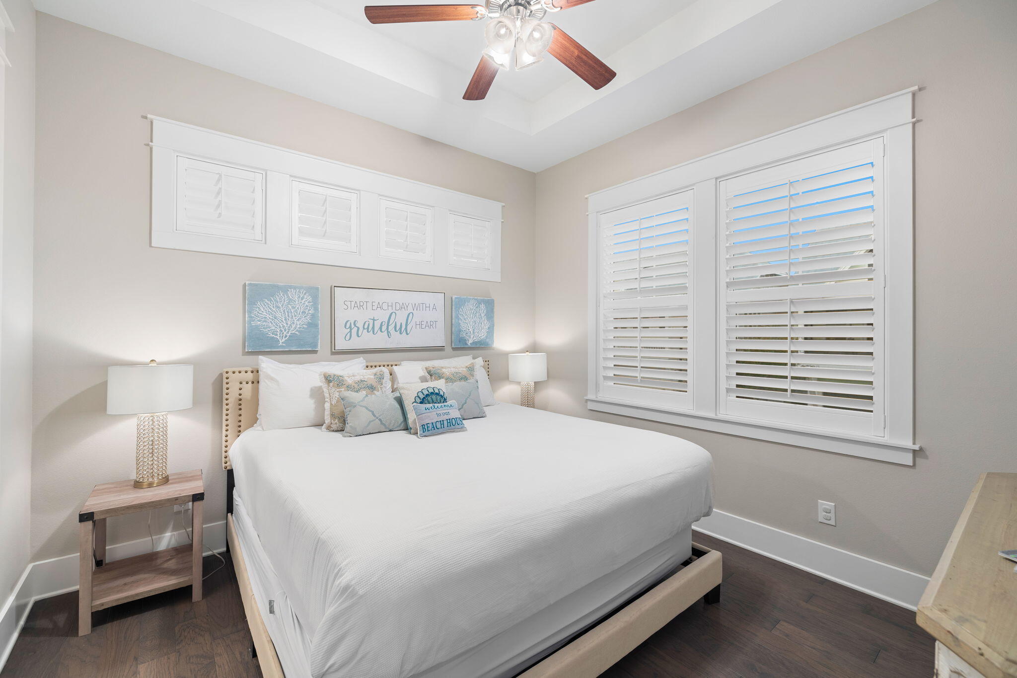 67 Milestone Dr Inlet Beach, Unit C Inlet Beach, FL 32461 - Photo 27 of 39 a bedroom with a large bed and a chandelier