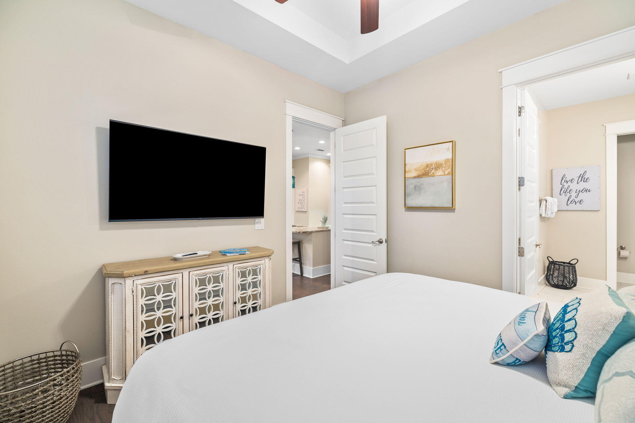 67 Milestone Dr Inlet Beach, Unit C Inlet Beach, FL 32461 - Photo 29 of 39 a bedroom with a bed and a flat screen tv