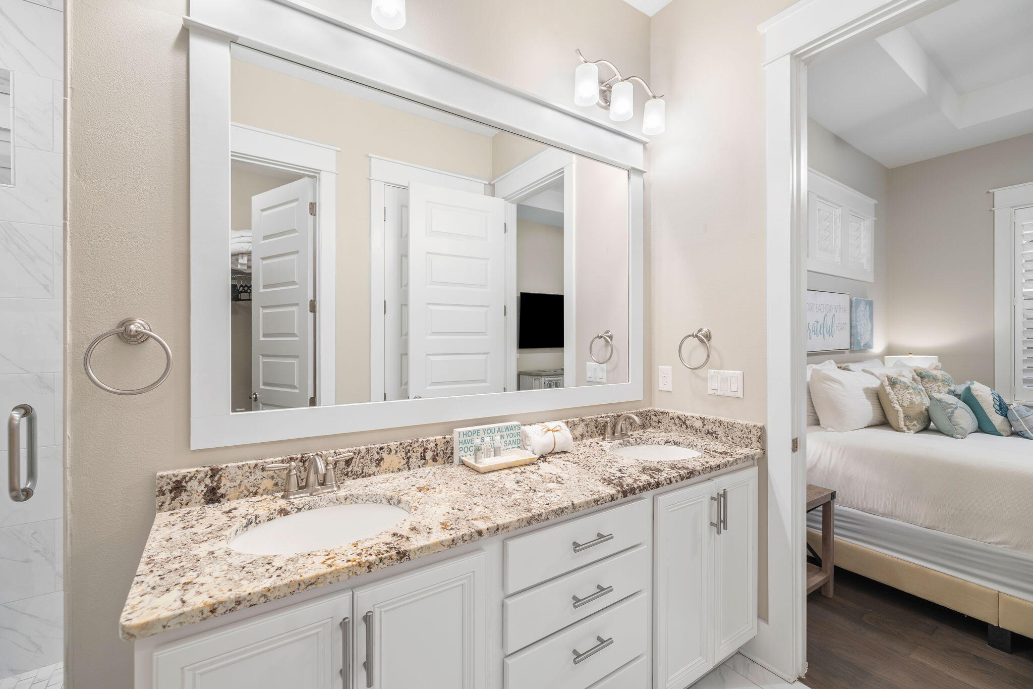 67 Milestone Dr Inlet Beach, Unit C Inlet Beach, FL 32461 - Photo 30 of 39 a bathroom with a granite countertop sink and a mirror
