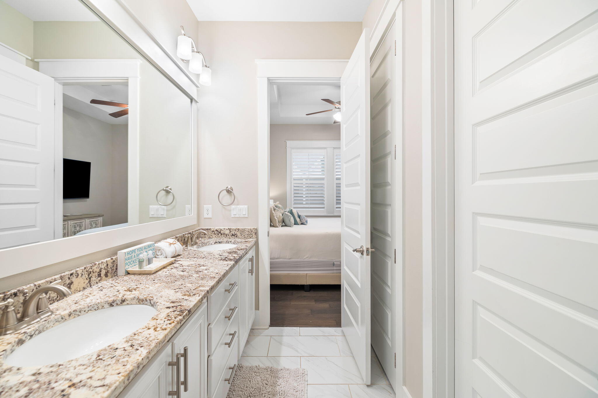 67 Milestone Dr Inlet Beach, Unit C Inlet Beach, FL 32461 - Photo 31 of 39 a bathroom with a granite countertop double vanity sink and a mirror