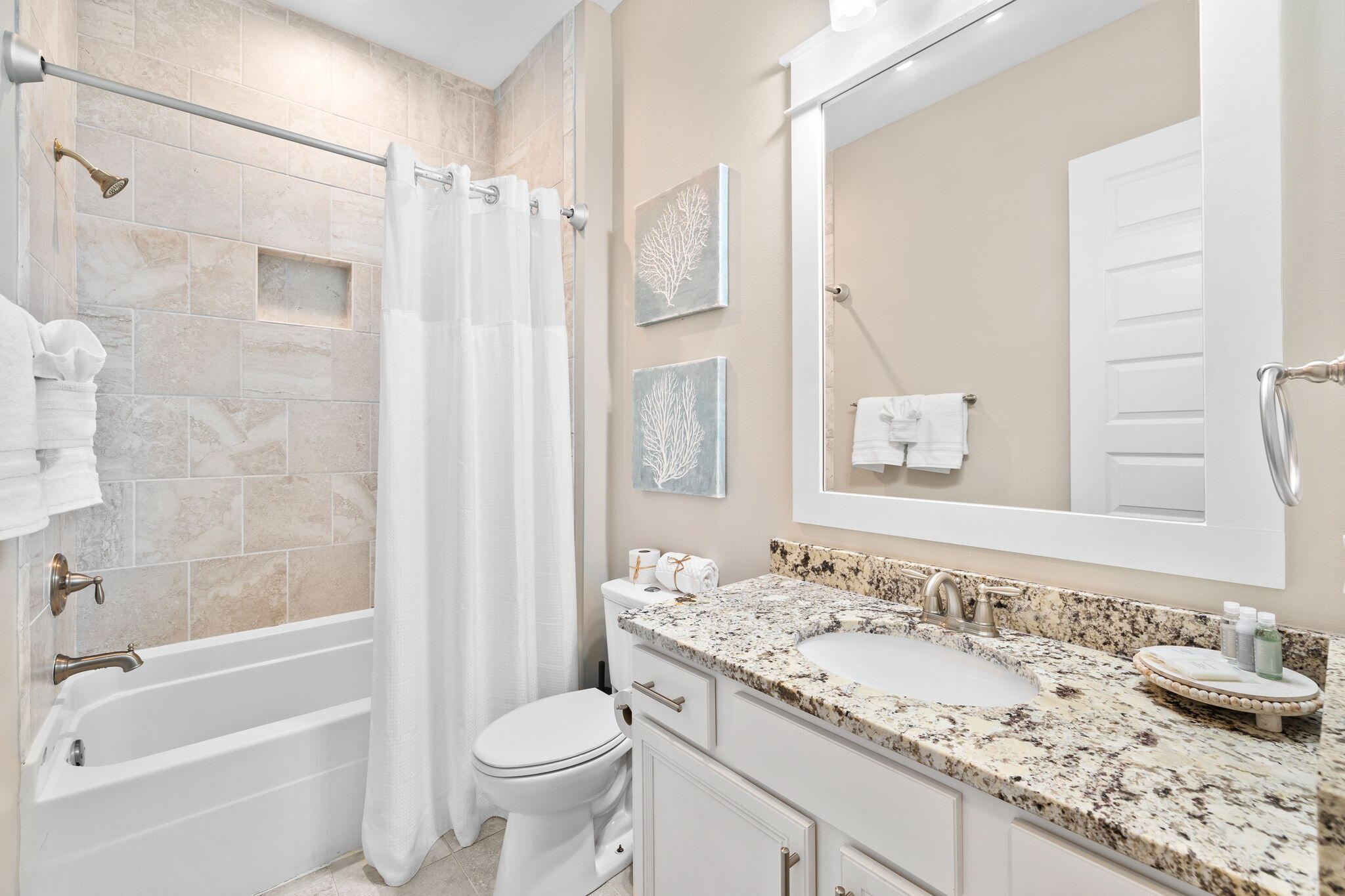67 Milestone Dr Inlet Beach, Unit C Inlet Beach, FL 32461 - Photo 36 of 39 a bathroom with a granite countertop sink toilet and shower