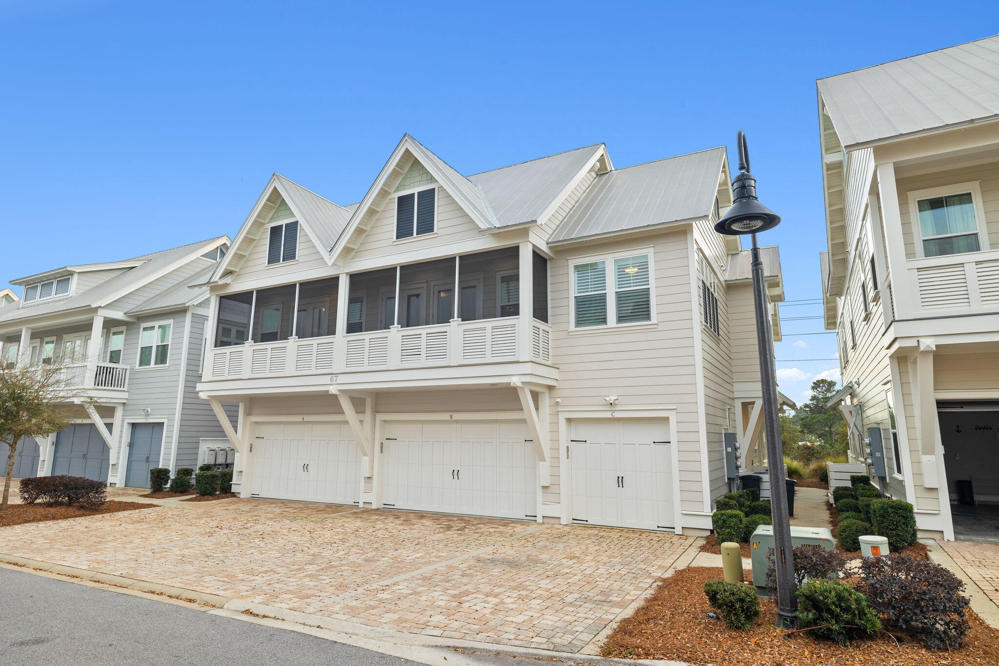 67 Milestone Dr Inlet Beach, Unit C Inlet Beach, FL 32461 - Photo 4 of 39 a front view of a house with a yard