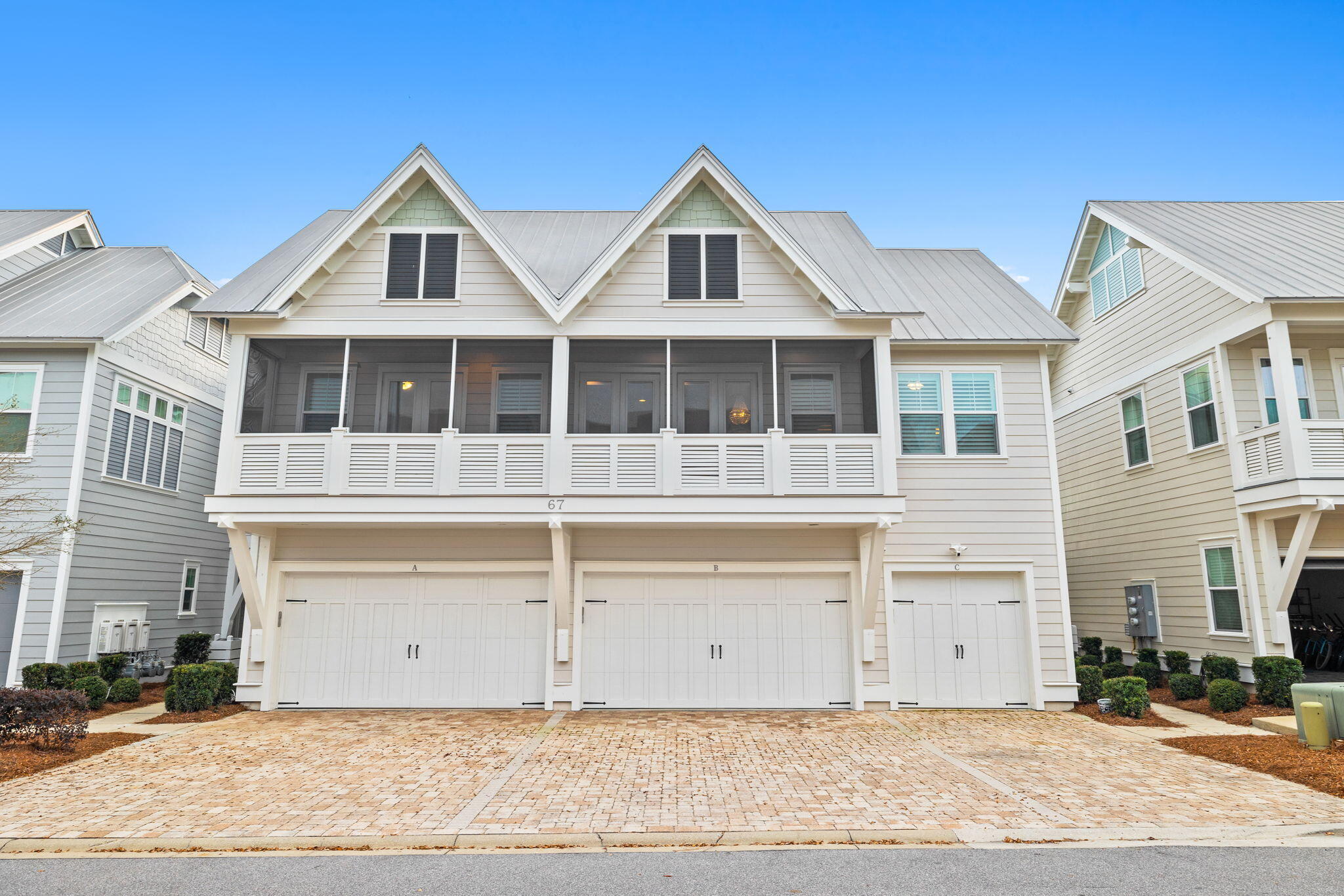 67 Milestone Dr Inlet Beach, Unit C Inlet Beach, FL 32461 - Photo 5 of 39 a front view of a house with a yard