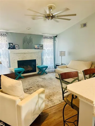 a living room with furniture and a fireplace