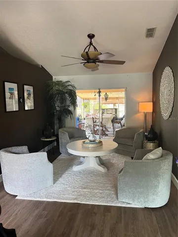 a living room with furniture and a large window