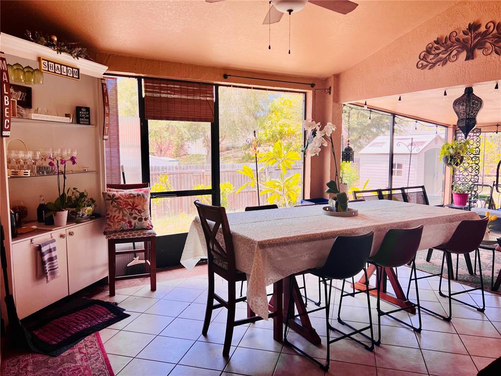 686 Park Valley Circle Minneola, FL 34715 - Photo 24 of 33 a view of a dining room with furniture window and outside view